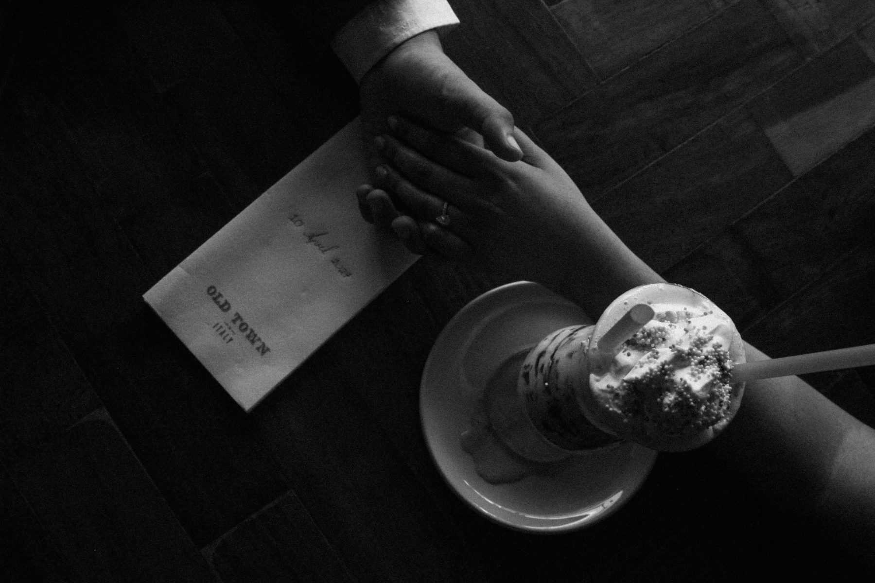 Hands held across the table